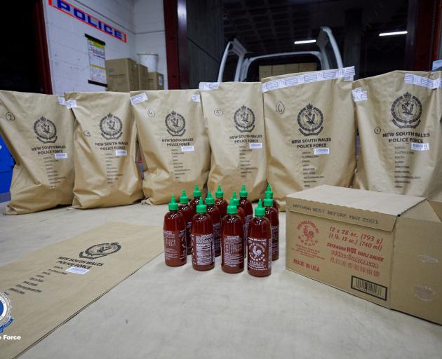 Bottles of sriracha hot chilli sauce seized by Australian police last month. Photo: NSW Police...