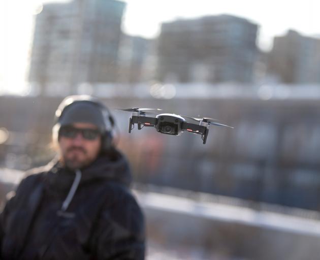 DJI demonstrated its drone-to-phone transmission app at the UN aviation agency's Drone Enable...