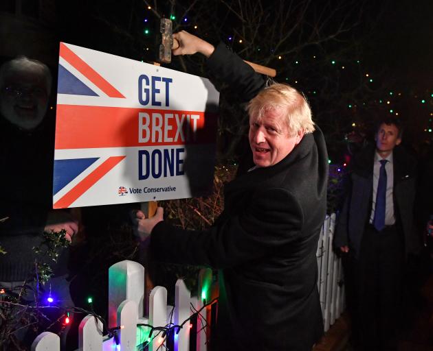 Boris Johnson hammered a "Get Brexit Done" sign into the garden of a supporter in the Essex town...