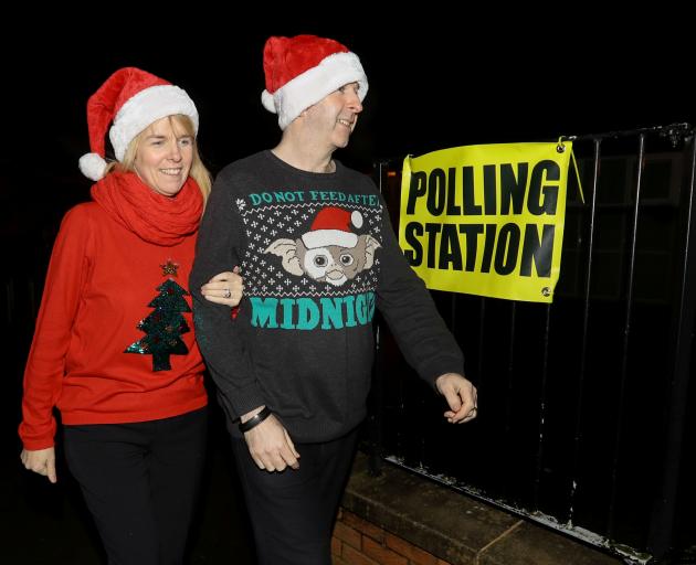 David and Karen Barry arrive at the polling station in West Belfast, Northern Ireland. Photo:...