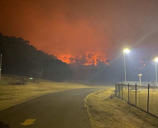 A bushfire burns near the Lithgow Correctional Centre compound in Marrangaroo, New South Wales....