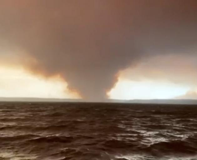 A huge plume of smoke from a fire at Currowan in New South Wales as seen from St George’s Basin....