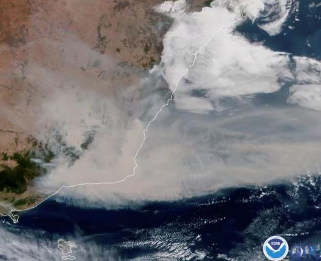 A satellite image shows bushfire smoke being blown away from Australia towards New Zealand on...