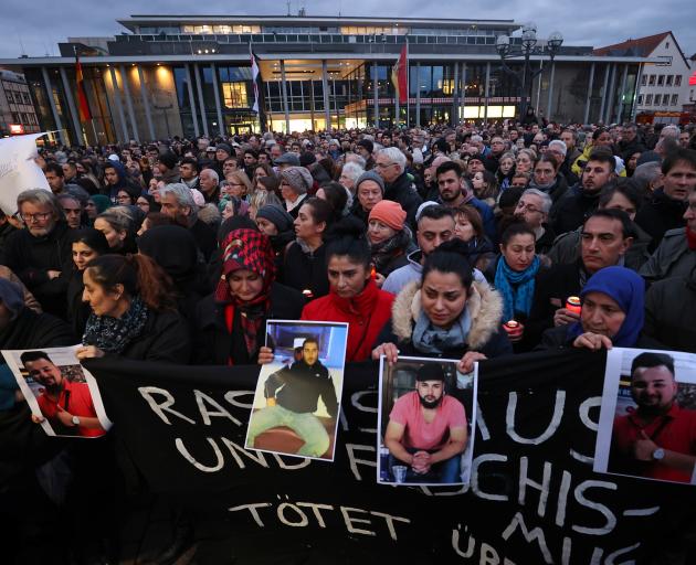 People attend a vigil for the victims of a shooting in Hanau. Photo: Reuters 