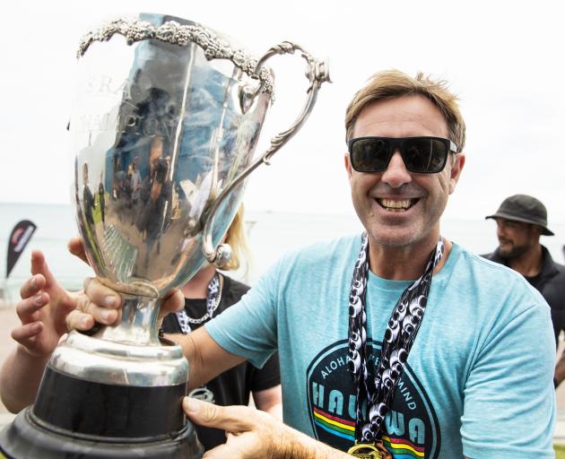 Lyndon Fairbairn celebrates winning the over-40s title at the 2020 New Zealand Surfing National...
