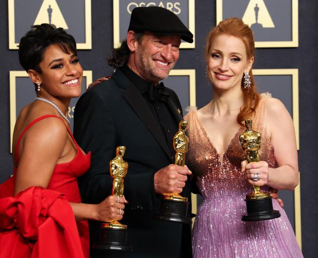 Best supporting actress winner Ariana DeBose (left) Best supporting actor winner Troy Kotsur and...