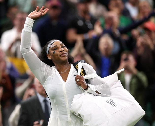 Serena Williams acknowledges the Wimbledon crowd after losing her three-set match. Photo: Reuters