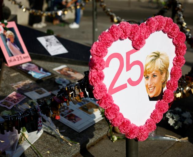 Pictures and flowers were left in memory of Diana around the Liberty Flame monument in Paris, the...