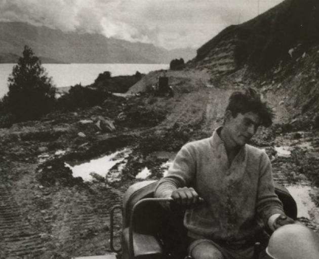 This photo of Ivan Smith dozing the Glenorchy Rd in muddy conditions graced the cover of his...