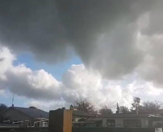 The mini-tornado as it leaves Matamata on yesterday afternoon. Photo: Selena Page via NZ Herald