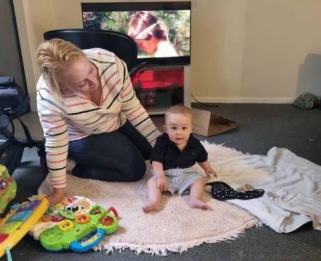 Peta Kerr pictured with her son William who suffered only a couple of bruises after the crash....
