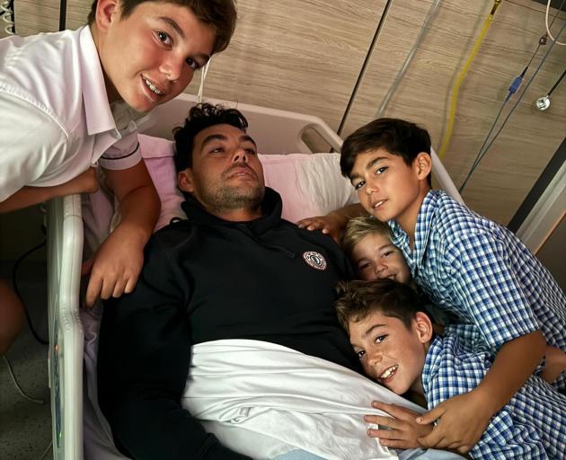 Dan Fong with his four sons. Photo: Supplied