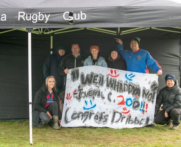 Owaka fans cheer on Parker during his 200th game of rugby for the club.