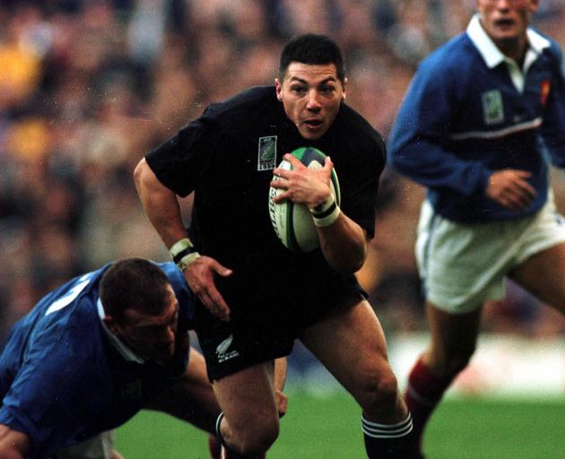 Byron Kelleher looks for space against France in the 1999 Rugby World Cup semifinal at Twickenham...