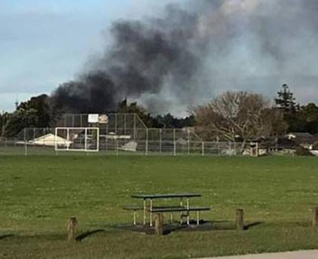 A black plume of smoke could be seen drifting from the property in Don Buck Rd. Photo: Jo Rule...