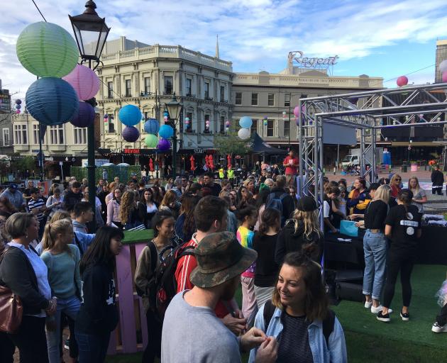 People gather in the 'Sheeran Hub' in the Octagon on Thursday morning, the day of his first...