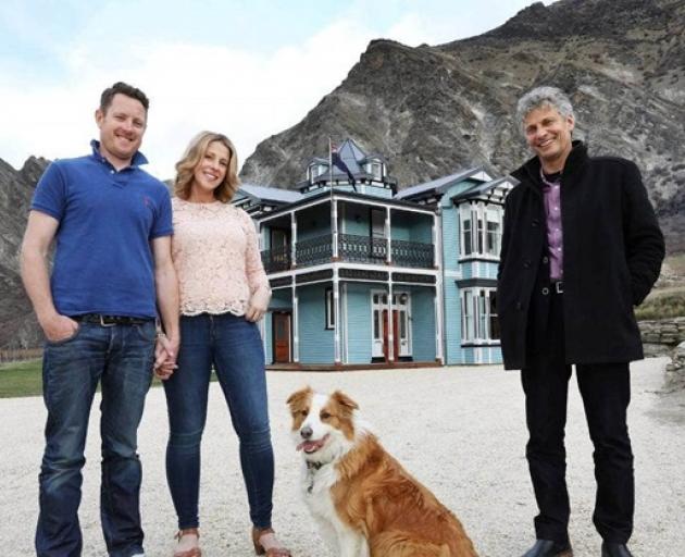 Previous owners Jamie and Melissa McMurtrie with Grand Designs host Chris Moller in front of the...