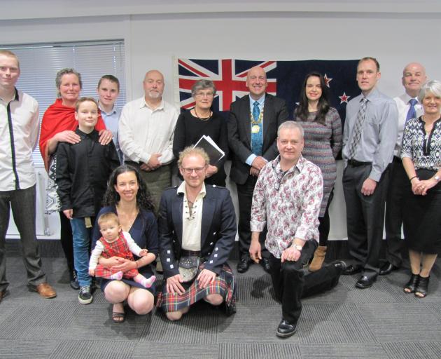 Central Otago Mayor Tim Cadogan congratulates Central Otago's newest New Zealand citizens after a citizenship ceremony in Alexandra last week. Photo: Pam Jones