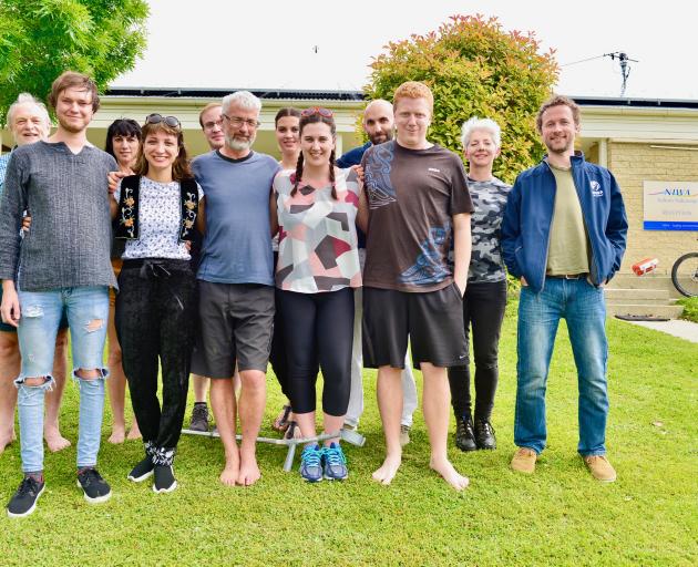 Auckland choreographer Carol Brown (back row, second from right) takes a break with dancers and...