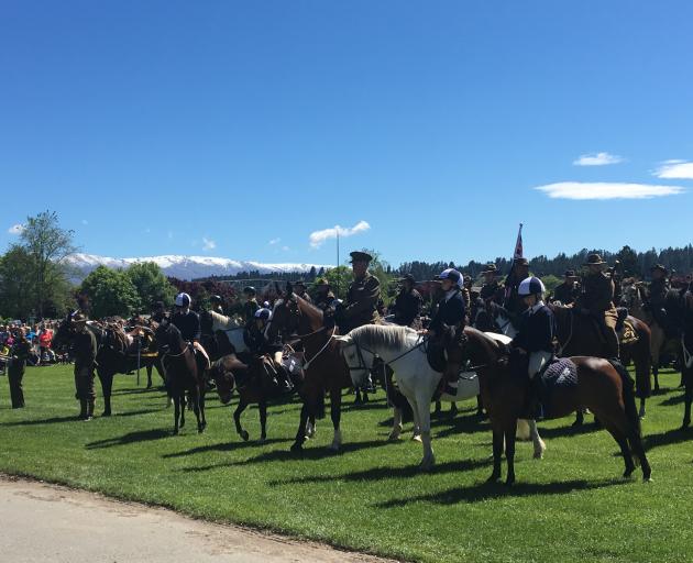 Members of the New Zealand Mounted Rifles Charitable Trust are joined by Central Otago adult and...