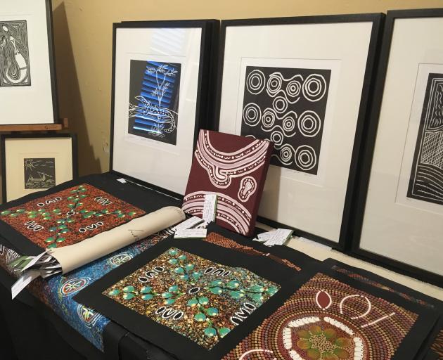 Framed and unframed art is on display at Aboriginal Bush Traders, in the historic Lyons Cottage, on Darwin's esplanade. PHOTO: PAM JONES