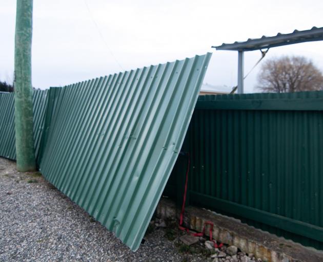 Roofing iron from outdoor shelters at the Omakau Bowls Club was blown over in the wind today....