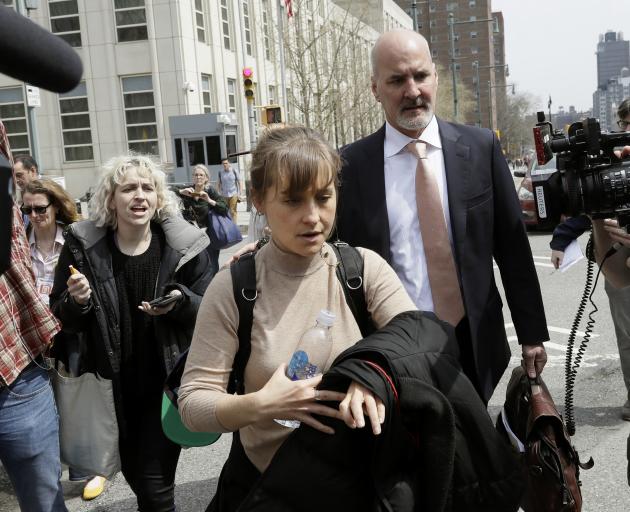 Allison Mack wept in court as she admitted her crimes and apologised to the women involved. She...
