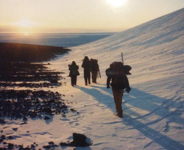 Cameraman Max Quinn and soundman Don Anderson tramp to an emperor penguin colony near Cape Crozier, accompanied by two helpers from Scott Base. PHOTO: SUPPLIED 