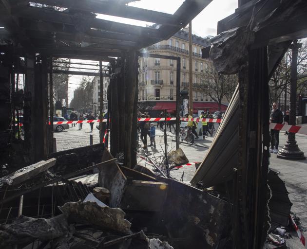 The burned out remains of well known restaurant Le Fouquet on the Champs Elysees. Photo:AP