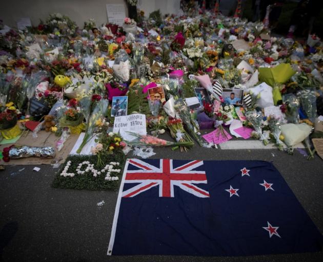 Flowers were placed in tribute to the victims on a wall outside the Al Noor mosque in...