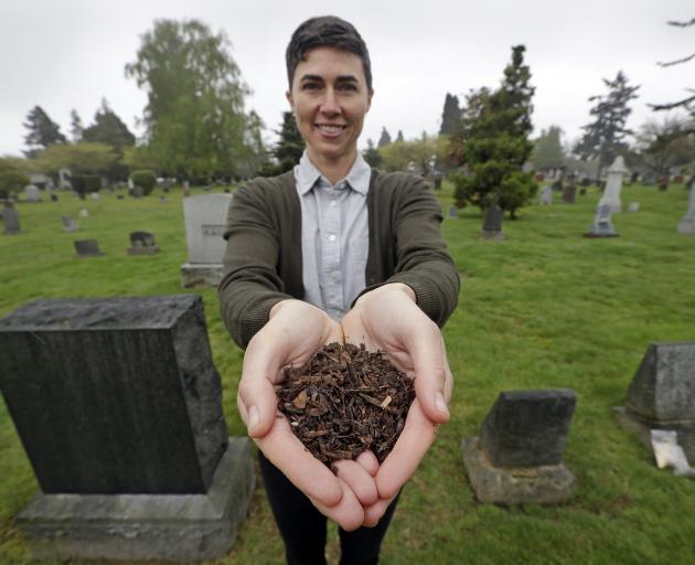 Katrina Spade, the founder of Recompose, with at a Seattle cemetery with a sample of compost...