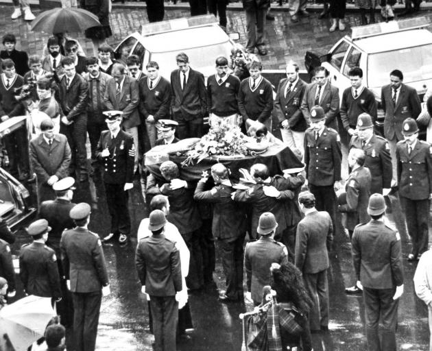 The coffinof Sergeant Stu Guthrie,  of Port Chalmers, who had been shot by David Gray, is carried...