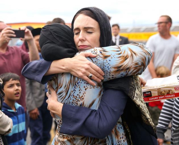 Prime Minister Jacinda Ardern hugs a mosque-goer at the Kilbirnie Mosque in Wellington, two days...