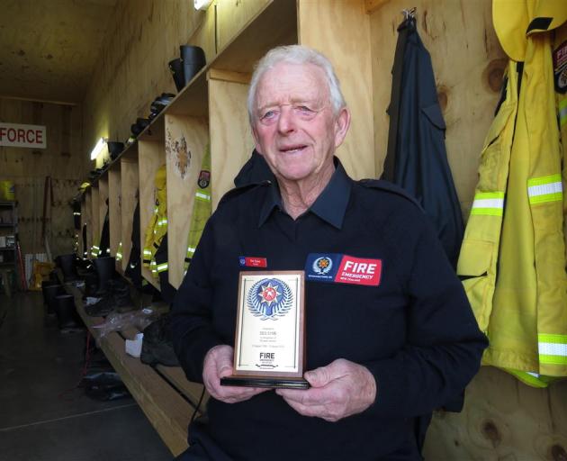 Des Syme with his plaque acknowledging his 65 years service. Photo: Supplied