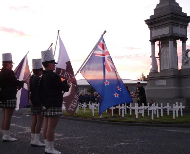Reverend Alex McLaughlin leads the dawn Anzac service at Balclutha Cenotaph this morning. Photo:...