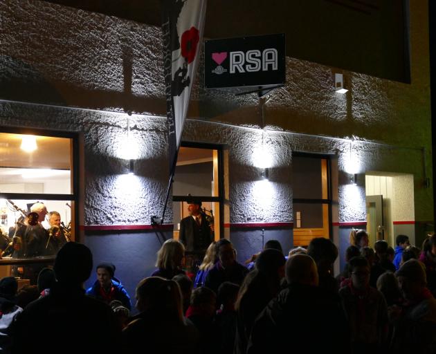 Locals gather outside the Clutha District RSA on Clyde St, Balclutha, in preparation for the...
