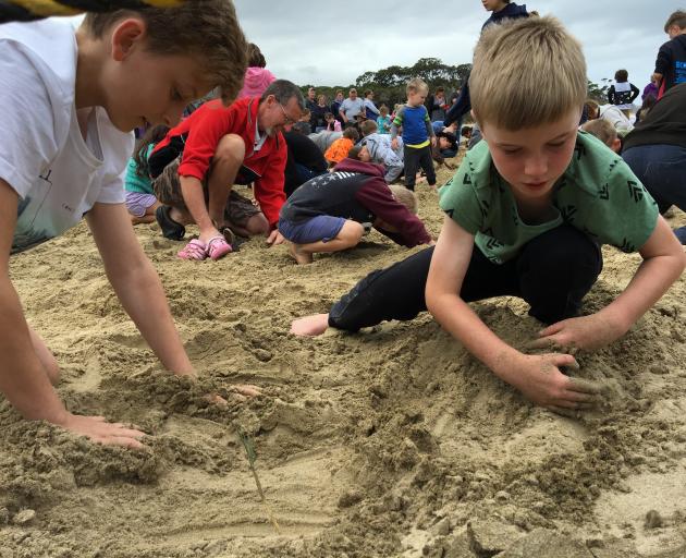 Ieuan Horlock (13, left) of Sydney, and Jackson Phillips (8) of Dunedin take part in the...