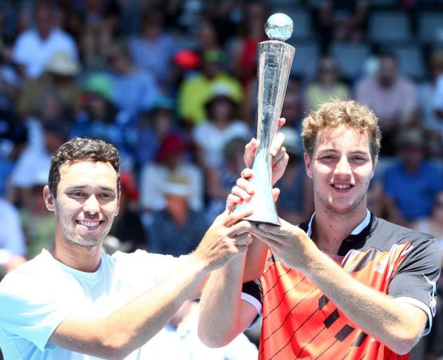 Ben McLachlan (left) and Jan-Lennard Struff celebrate with the trophy yesterday. Photo: Getty...