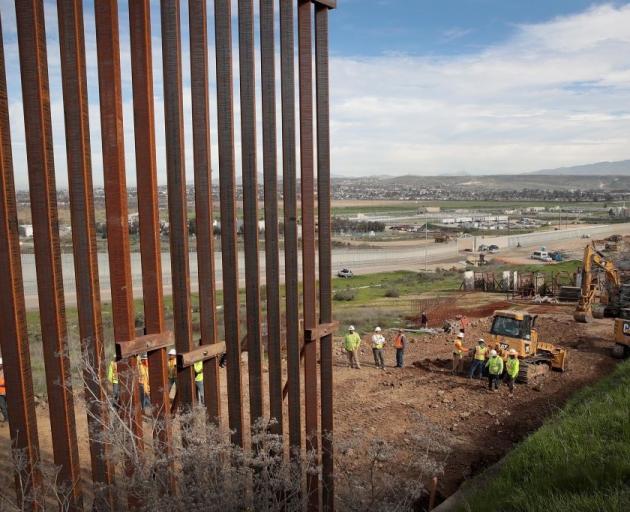 About 1120km of fencing has been erected along the US border with Mexico. Photo: Getty Images 