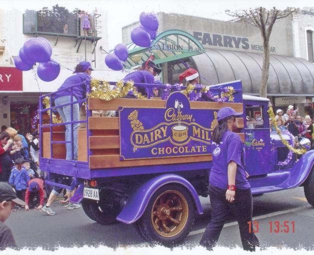 A Cadbury van joins a  parade. 