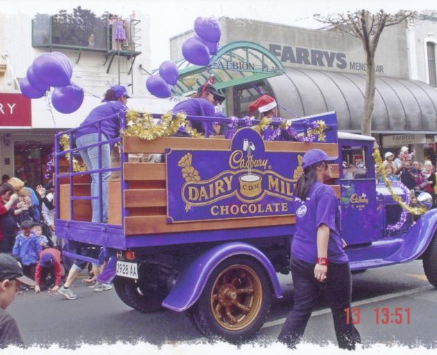 A Cadbury van joins a parade.