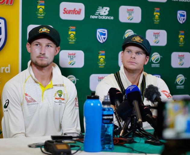 Cameron Bancroft (left) and Steve Smith face media after the ball tampering incident in South...
