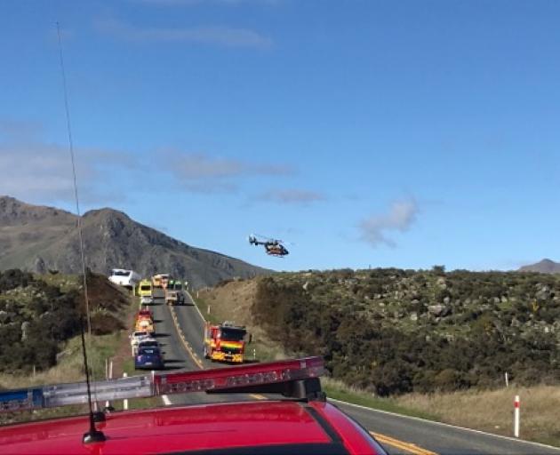 A helicopter leaves the crash scene. Photo: Daisy Hudson