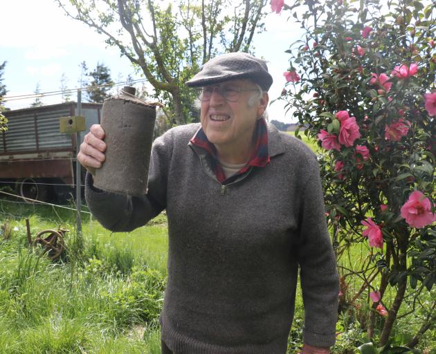 Balclutha resident Mel Tapp holds an old water bottle he took from the Milton Town Hall more than...