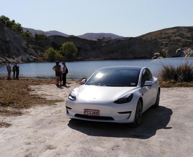 Our Tesla model 3 takes a break at Blue Lake in St Bathans. PHOTO: RAY PILLEY