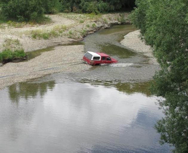 Concerns have been raised about the safety of swimmers in the Manuherikia River after a four-wheel-drive became stuck in the riverbed recently. PHOTO: SUPPLIED