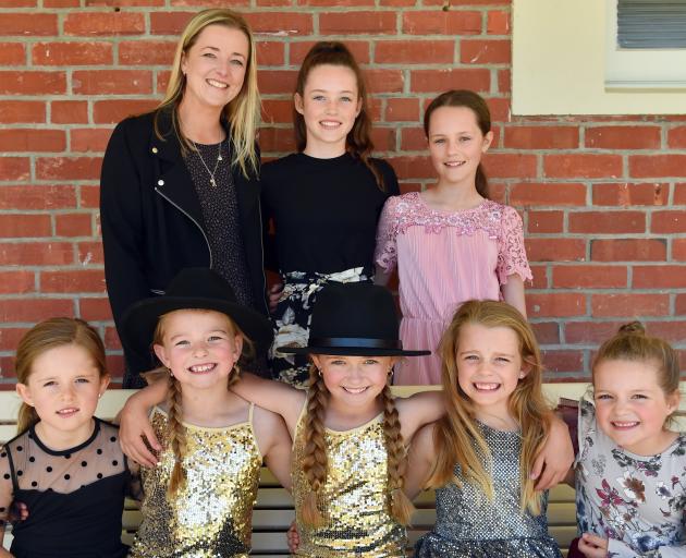 Country music teacher Kayla Martin with her daughter and nieces (centre back) Caitlyn Byars (14),...