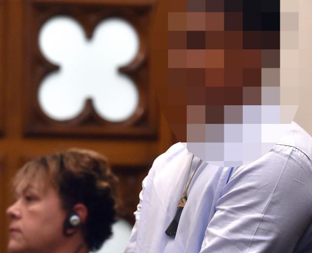The accused stands in the dock before the High Court at Dunedin yesterday. Photo: Peter McIntosh