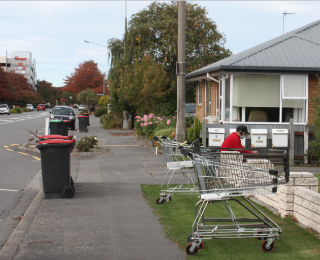 A Riccarton man jams to some music on the border of his property.