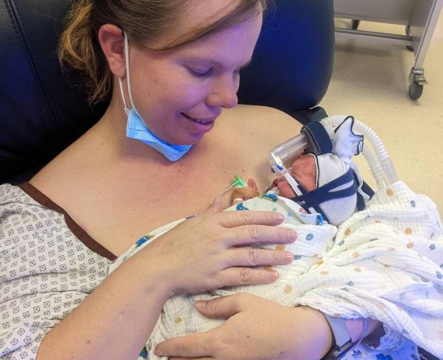 Napier mum Joanne Wills with her baby Oliver, one of four quadruplets. Photo: Supplied